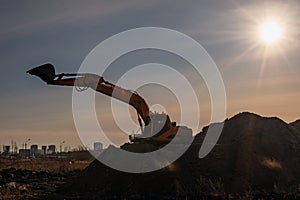 excavator sunset background for construction concept. heavy machine construction site soil excavate for foundation work