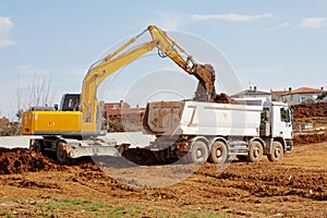 Excavator and tipper truck