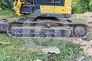 Excavator tracks. Old iron caterpillars of the bulldozer of the tractor on the road. bulldozer caterpillar tracks. Black caterpill