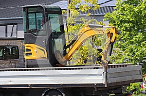 Excavator on a truck city street