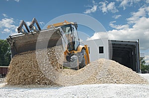 Excavator unload gravel photo