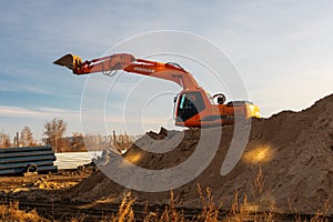 Excavator used for pipe laying works and house foundation. Doosan earth mover machine Russia, Omsk, 13.11.2019