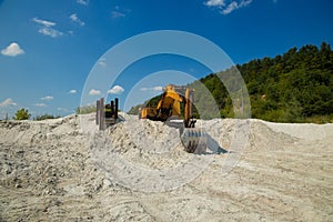Excavator in wasteland polluted area outdoor environment