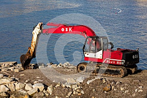 Excavator on the waterfront in Trapani, Sicily