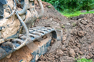 Excavator work with claying soil