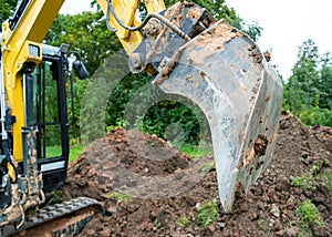 Excavator work with claying soil