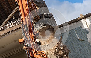 Excavator at work on demolition site