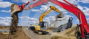 Excavator working on construction site with dramatic clouds on sky