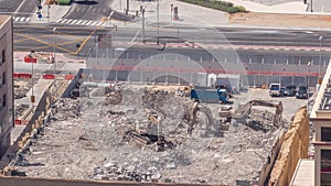 Excavator working at construction site on earthworks aerial timelapse.