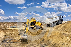 excavator is working and digging at construction site