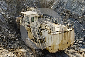 Excavator working in open pit machinery