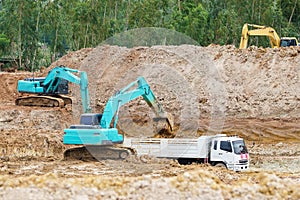 Excavator working removing earth on a construction site.