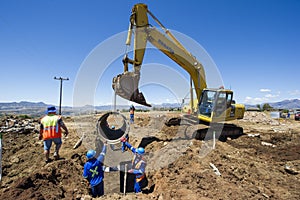 Excavator working on road.