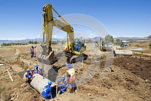 Excavator working on road.
