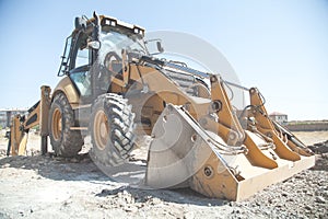 Excavator works at a construction site