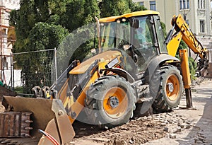 Excavator works at the construction site