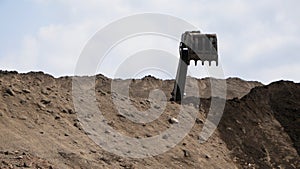 Excavator works on a dump in open pit mining. Heavy construction equipment. Quarry mining