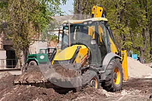 Excavator works with the earth