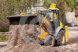 Excavator works with the earth