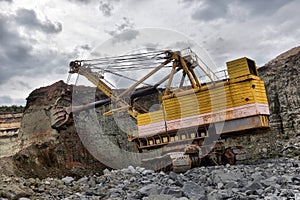 Excavator works or ore at opencast mining