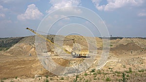 The excavator works in a quarry