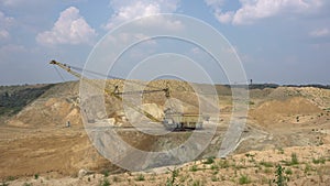 The excavator works in a quarry