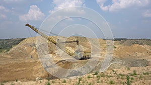 The excavator works in a quarry