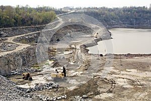 Excavator works quarrying