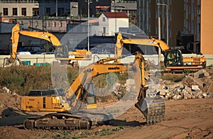 Excavators diggers at a construction site. Construction machinery at the facility