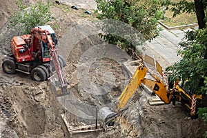 Excavators digging a pit