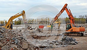 Excavators dismantling a large old industrial area for a redevelopment in a future commercial area