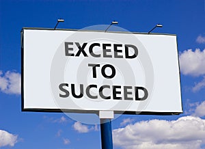 Exceed to succeed symbol. Concept words Exceed to succeed on beautiful big white billboard. Beautiful blue sky cloud background. photo