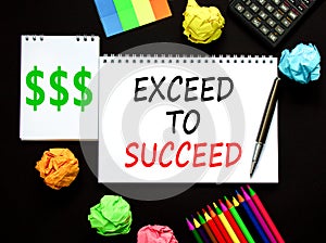 Exceed to succeed symbol. Concept words Exceed to succeed on beautiful white note. Beautiful black background. Black pen. Colored