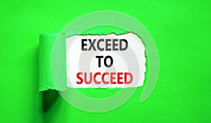 Exceed to succeed symbol. Concept words Exceed to succeed on beautiful white paper. Beautiful green paper background. Business and