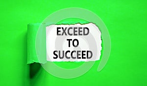 Exceed to succeed symbol. Concept words Exceed to succeed on beautiful white paper. Beautiful green paper background. Business and