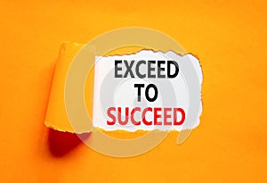 Exceed to succeed symbol. Concept words Exceed to succeed on beautiful white paper. Beautiful orange paper background. Business