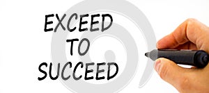 Exceed to succeed symbol. Concept words Exceed to succeed on beautiful white paper. Beautiful white table white background.