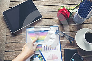 Excel Spreadsheet stats graph analytics data. Accountant hands holding Financial Document Trading Information with excel file.