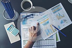 Excel Spreadsheet stats graph analytics data. Accountant hands holding Financial Document Trading Information with excel file. photo