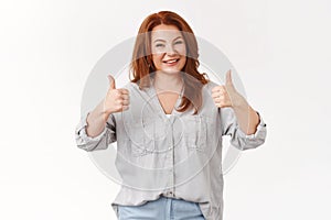 Excellent job, proud you. Charming middle-aged happy redhead wife show thumbs-up gesture like husband effort repaired