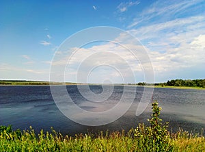 Excellent landskape in the lake with blue sky and clouds