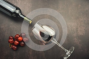 Excellent red wine bottle, glass and red grapes
