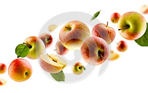 Excellently retouched multi colored apples with leaves whole halves and slices fly in space forming a chain shape. Surround light
