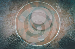 Excentric circles on a pile with rusty metallic texture in San Pedro de Atacama, Chile