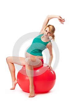 Excercising pregnant woman - isolated