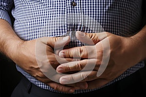 Excessive adiposity A hand clutches extra abdominal fat, signifying obesity