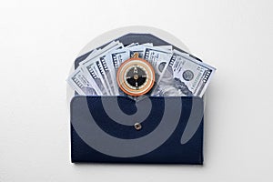 Exchange rate. Wallet with money (dollar banknotes) and compass on white background, top view
