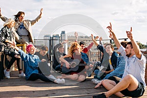 Exchange students singing rooftop together bonding