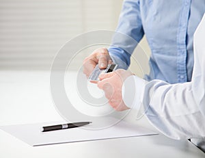 Exchanging credit card over the table