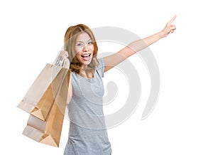 Excite woman with shopping bag and finger up